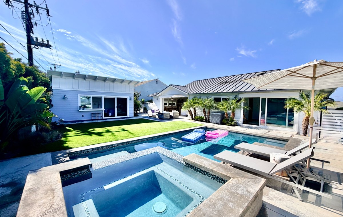 Outdoor living and pool area at the coastal Redondo Beach home.